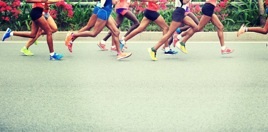 A group of people running in a road race