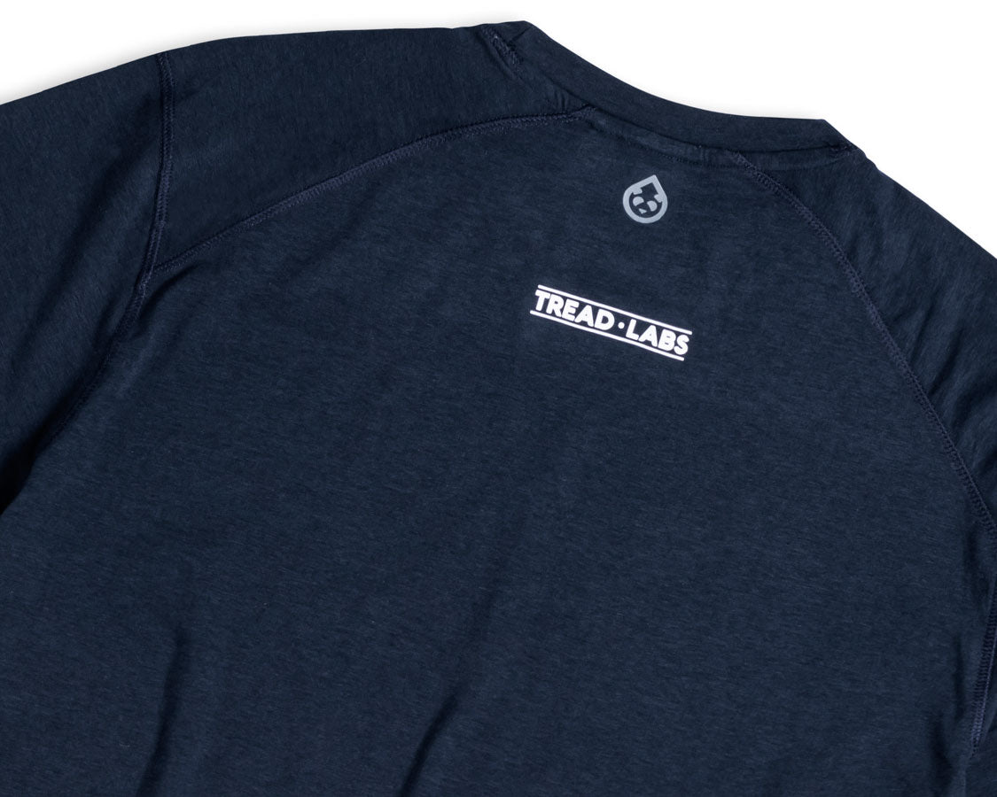 Back detail of men's dark blue t-shirt with Tread Labs logo